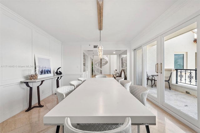 dining room featuring crown molding and french doors