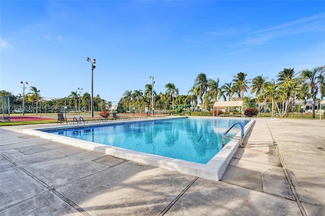 view of swimming pool with a patio area