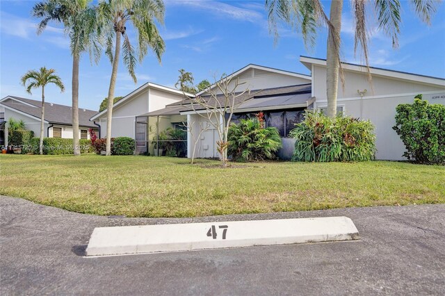 view of front of property with a front lawn