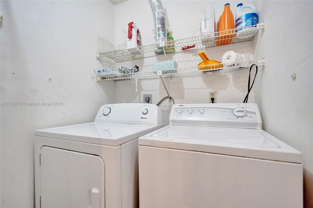 laundry area with washing machine and dryer