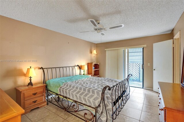 tiled bedroom featuring a textured ceiling, access to outside, and ceiling fan