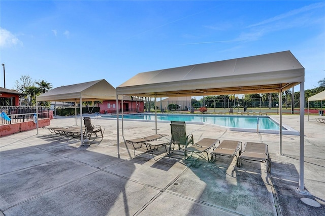 view of swimming pool with a patio area