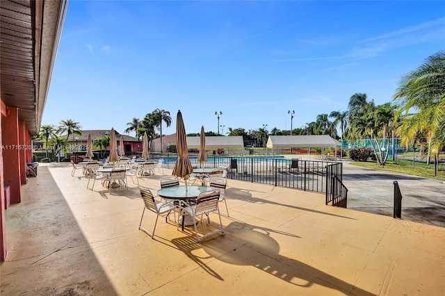 view of patio featuring a community pool