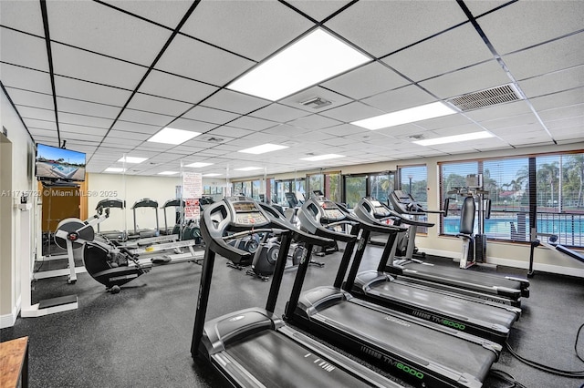 workout area with a paneled ceiling