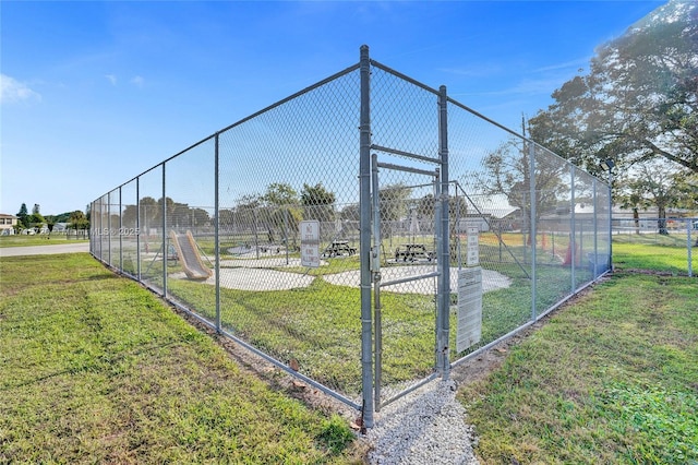 view of home's community featuring a lawn