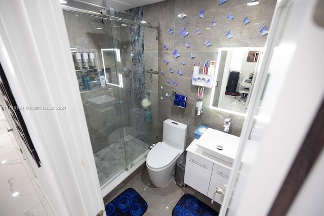 bathroom featuring vanity, toilet, and walk in shower