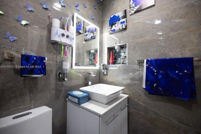 bathroom with vanity and toilet