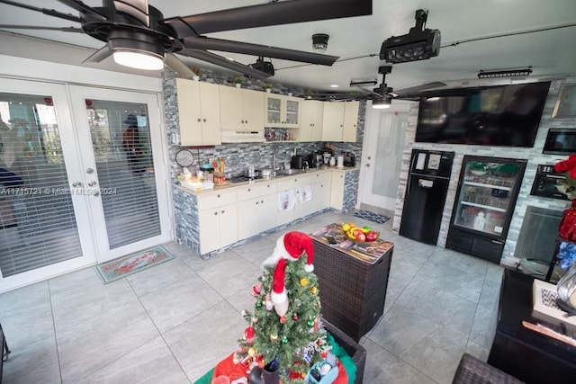 kitchen with ceiling fan, french doors, sink, backsplash, and cream cabinetry