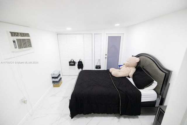 bedroom featuring a wall unit AC