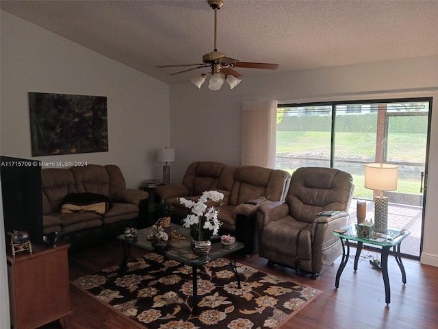 living room featuring wood-type flooring, a textured ceiling, plenty of natural light, and ceiling fan