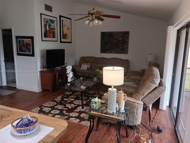 living room with ceiling fan, wood-type flooring, and lofted ceiling