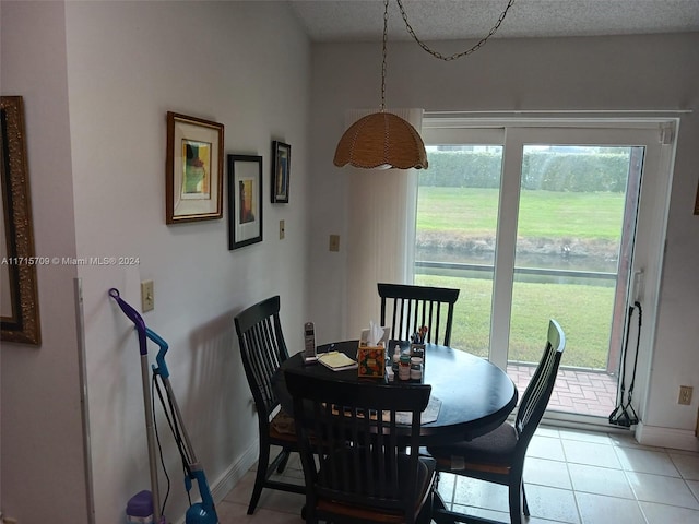 dining area with light tile patterned floors