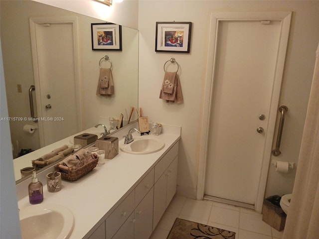 bathroom featuring tile patterned flooring and vanity