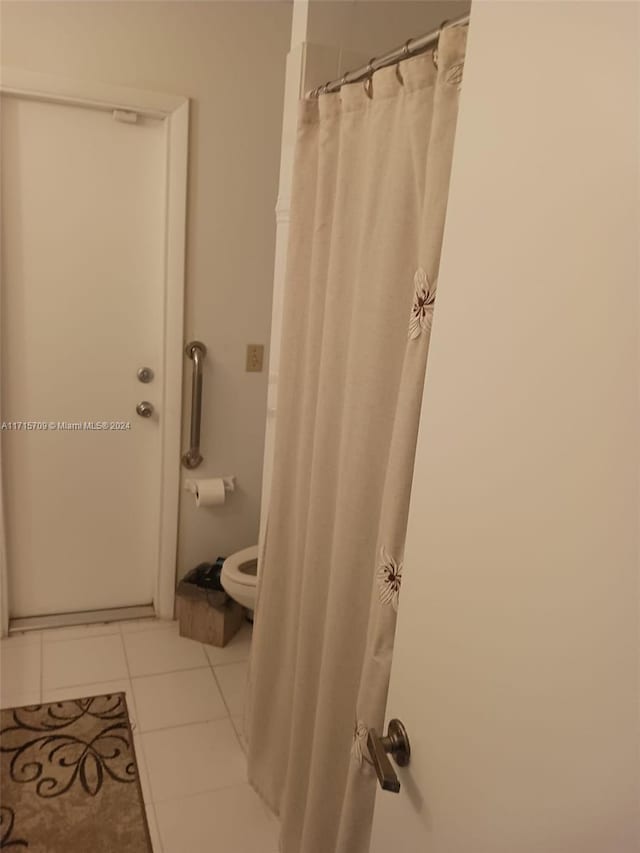 bathroom with tile patterned flooring