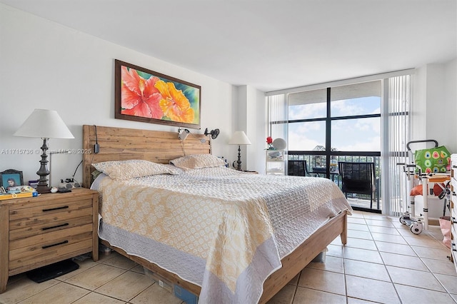 bedroom with light tile patterned floors, access to exterior, and floor to ceiling windows