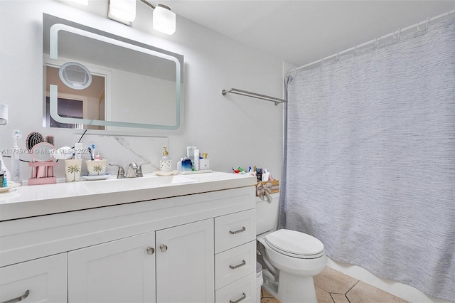 bathroom featuring vanity, tile patterned floors, toilet, and a shower with curtain