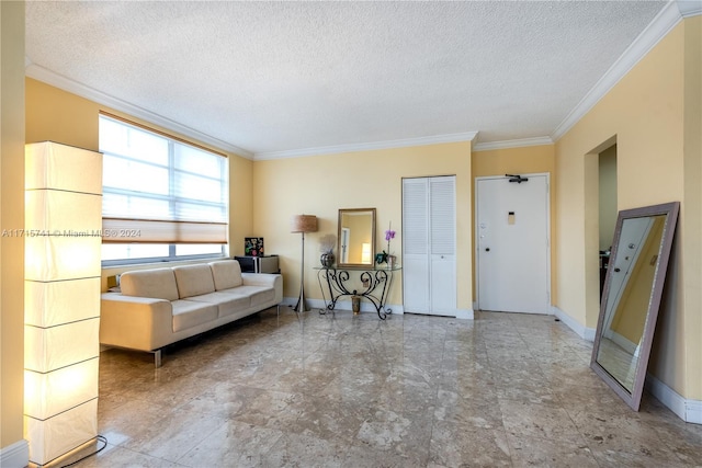 living room with a textured ceiling and crown molding