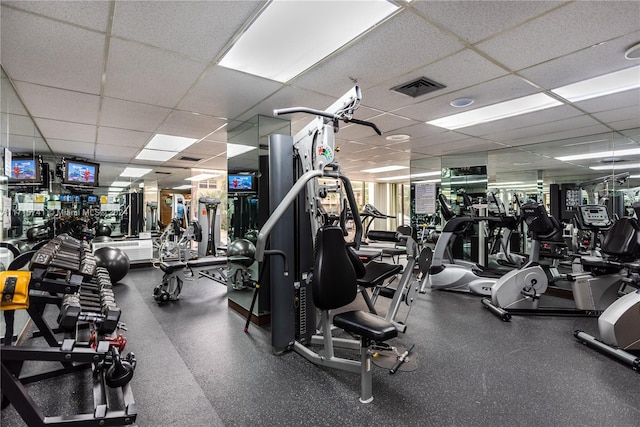 workout area with a drop ceiling