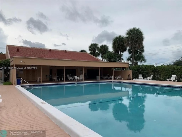 view of pool featuring a patio