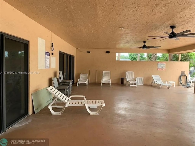 view of patio featuring ceiling fan