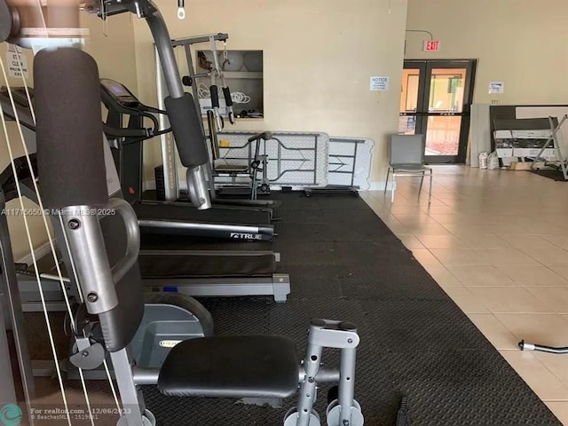 exercise room with tile patterned flooring