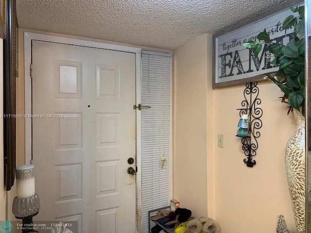 interior space featuring a textured ceiling