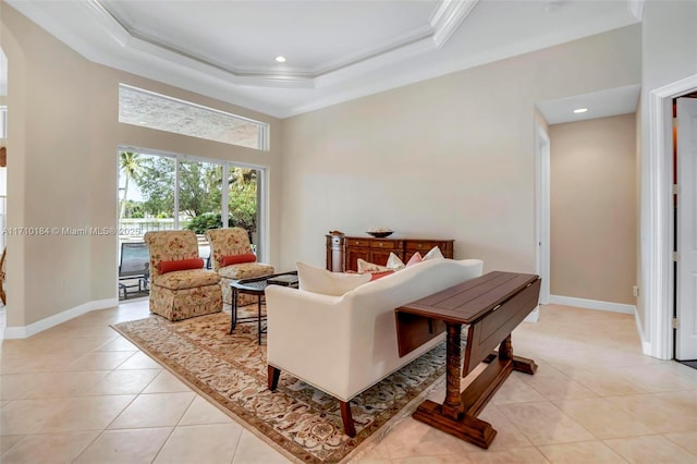 tiled living room featuring a raised ceiling and crown molding