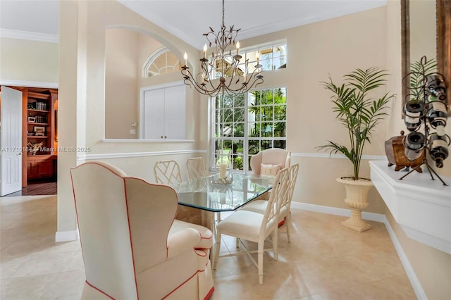 tiled dining space with an inviting chandelier and ornamental molding