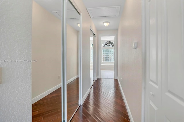 corridor featuring dark hardwood / wood-style floors