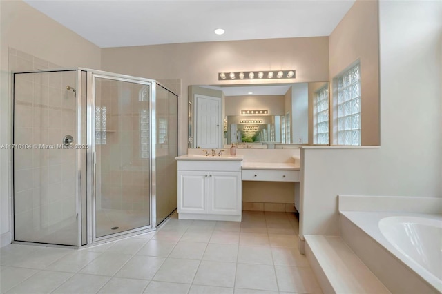 bathroom with tile patterned floors, vanity, and independent shower and bath