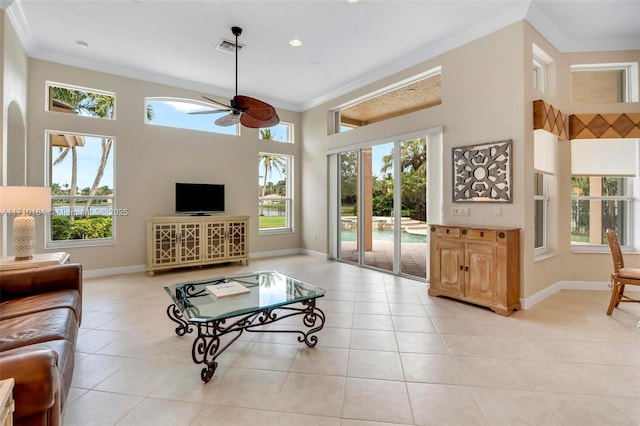 living room with ceiling fan, light tile patterned floors, and ornamental molding