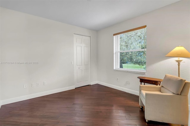 living area with dark hardwood / wood-style flooring