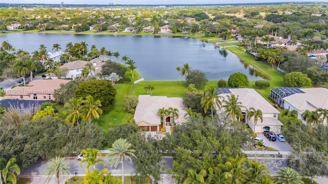 birds eye view of property with a water view