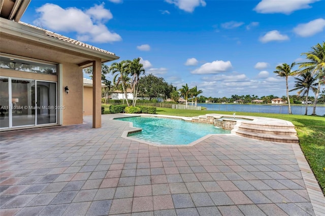 view of swimming pool featuring an in ground hot tub, a patio, and a water view