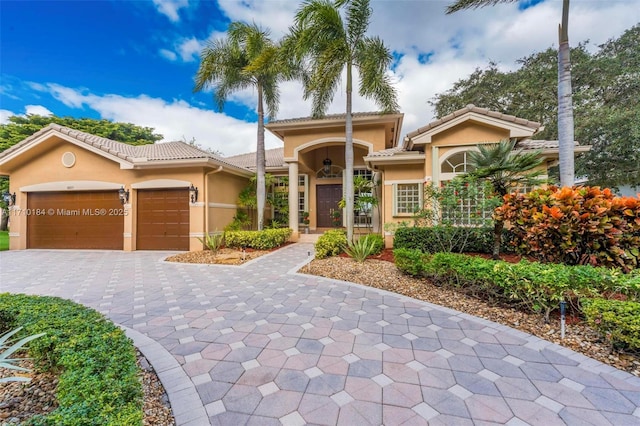 mediterranean / spanish-style home featuring a garage