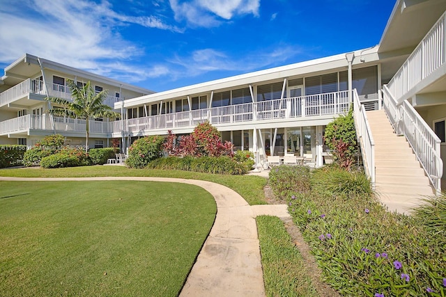 view of property's community with a yard