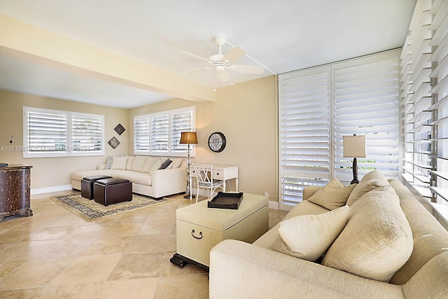 living room with beam ceiling and ceiling fan