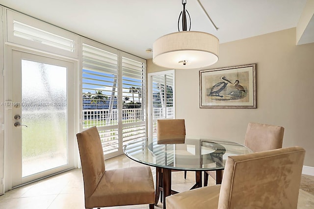 dining room with plenty of natural light and light tile patterned flooring