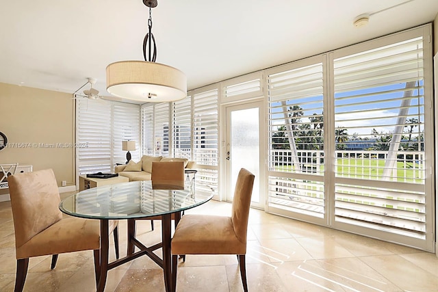 dining space with light tile patterned floors