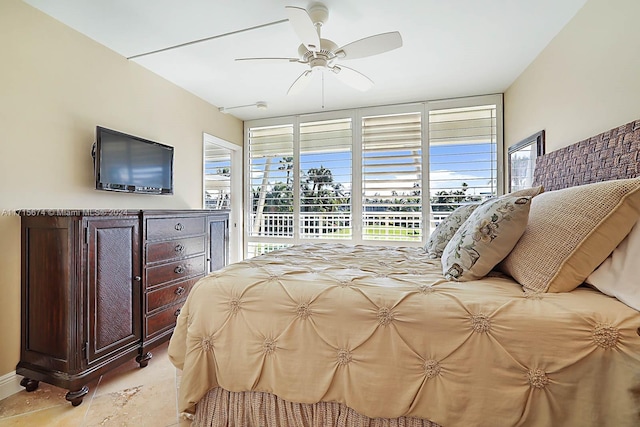 bedroom with light tile patterned floors, access to outside, and ceiling fan