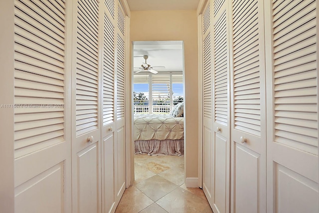 hallway with light tile patterned floors