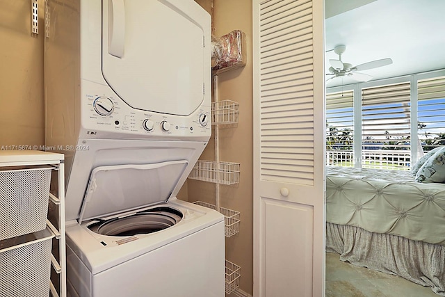 laundry room with stacked washer and dryer and ceiling fan