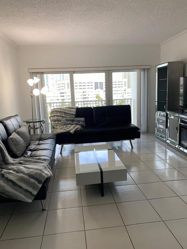 living room with tile patterned flooring and a textured ceiling