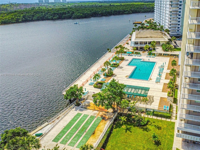 birds eye view of property with a water view