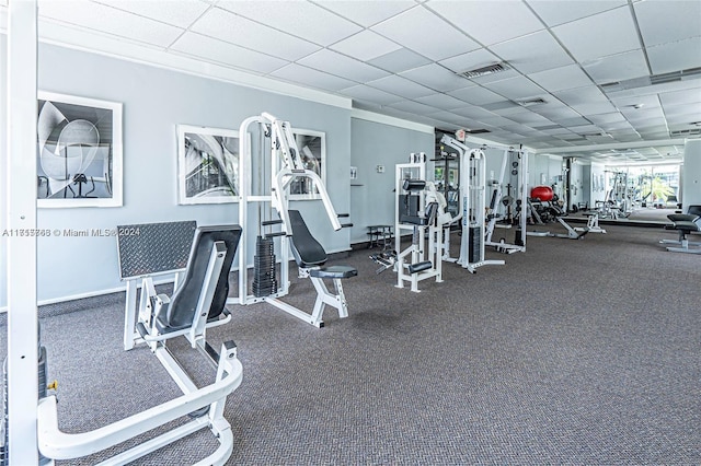 gym featuring a paneled ceiling