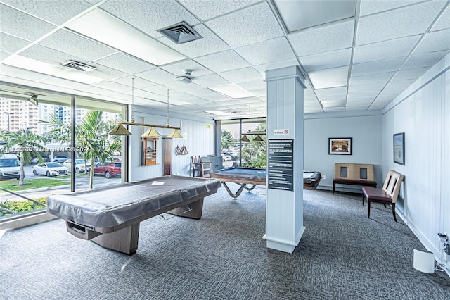 playroom with dark colored carpet, a healthy amount of sunlight, a wall of windows, and billiards