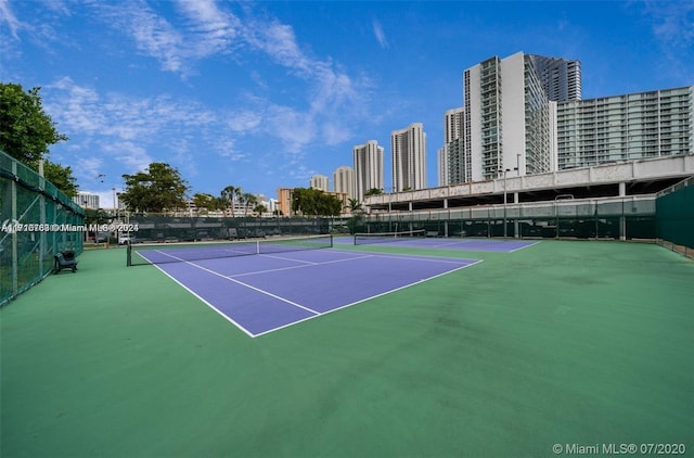 view of tennis court with basketball court