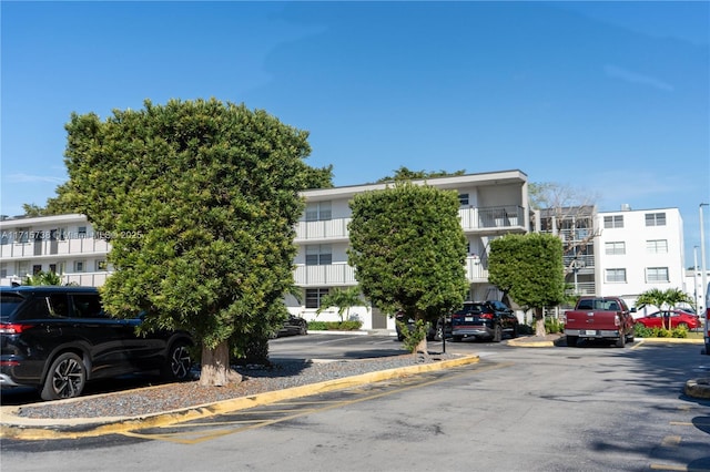 view of property featuring uncovered parking