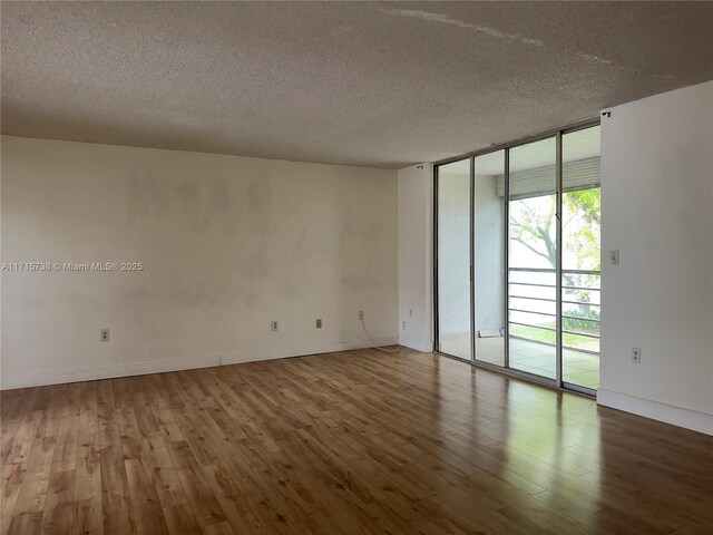 bedroom with a textured ceiling and a closet