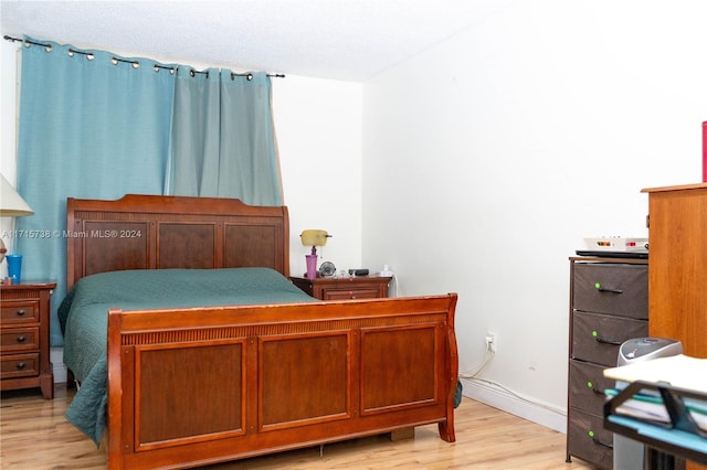 bedroom featuring light wood-type flooring